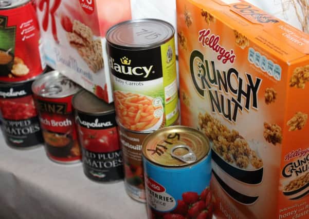 Tins and packet at a foodbank. Image licenced by Creative Commons by Bromford from Flickr