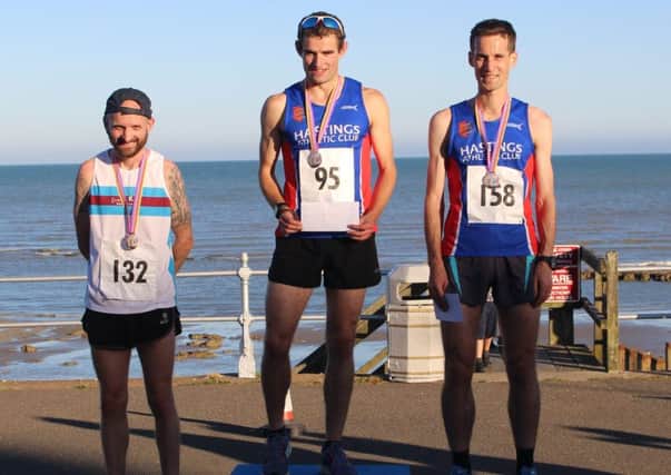 Rhys Boorman on top of the podium at the second event in the Bexhill Seafront 5K Series with Hastings AC clubmate James Mountford on the right in second place.