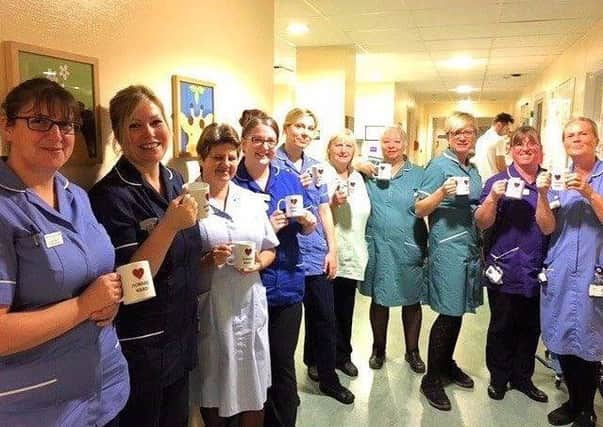 Howard ward staff at St Richard's Hospital, Chichester, have a cup of tea to mark the 70th birthday of the NHS