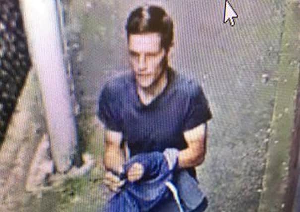 Officers would like to speak to this man after an elderly man had his money stolen in Worthing. Picture: Sussex Police