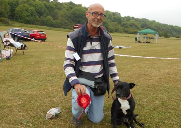 Laurie Servante and Poppet, a Staffordshire bull terrier judged first in the rescue class and best in show at the fourthannual Findon Valley Dog Show