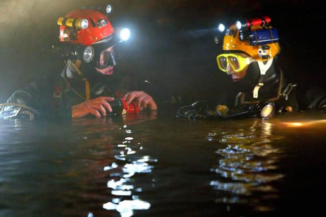 British divers Rick Stanton (right) and John Volanthen (left) were the first to reach twelve trapped schoolboy footballers in the waters of the cave system in Tham Luang, Thailand (Photograph: SWNS) SUS-180307-112156001