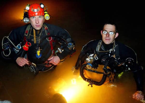 British divers Rick Stanton (right) and John Volanthen (left) were the first to reach twelve trapped schoolboy footballers in the waters of the cave system in Tham Luang, Thailand (Photograph: SWNS) SUS-180307-112145001