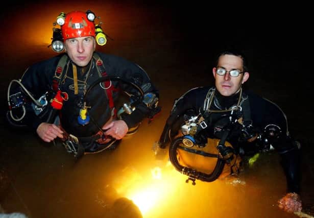 British divers Rick Stanton (right) and John Volanthen (left) were the first to reach twelve trapped schoolboy footballers in the waters of the cave system in Tham Luang, Thailand (Photograph: SWNS) SUS-180307-112145001