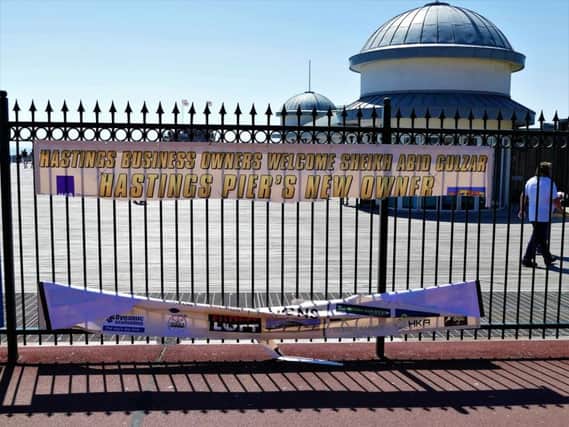 A welcome sign outside Hastings Pier was ripped in half. SUS-180407-104613001