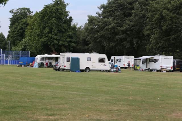 A group of travellers arrive at Tarring Park, Worthing SUS-180407-110200001