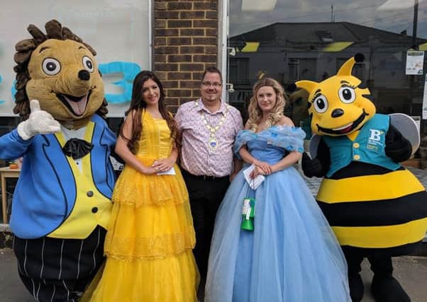 Billy at the St Barnabas House hospice shop in Wick with Barnaby Bee, Hampton the Hedgehog plus Disney princesses Cinderella and Belle