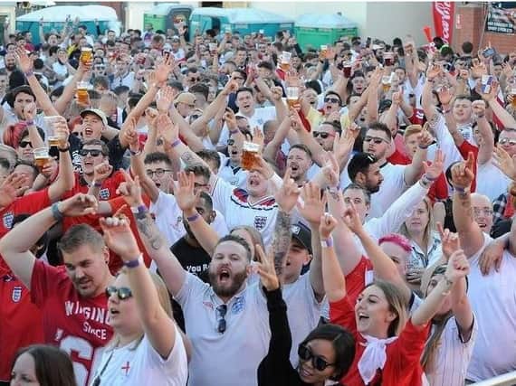 England supporters celebrate beating Colombia