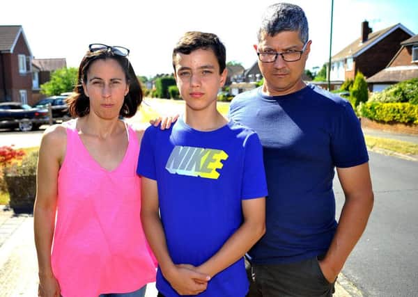 Campaign after Horsham boy hit by car outside Forest school. Oliver Colombo with his parents Gail and Patricio. Pic Steve Robards SR1817278 SUS-180307-104333001