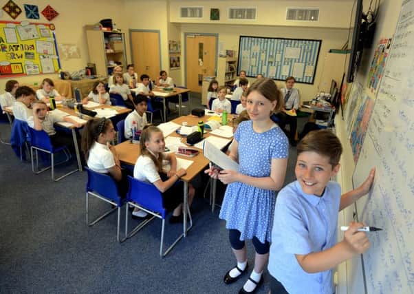 Ella Beardsley, 11, and Jasper Smith, 11, were head teacher for a day at Thomas  A'Becket Junior School in Worthing. Picture: Kate Shemilt ks180312-2