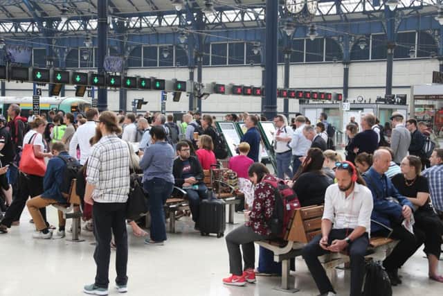 Passengers at Brighton station this morning (Photograph: Eddie Mitchell)