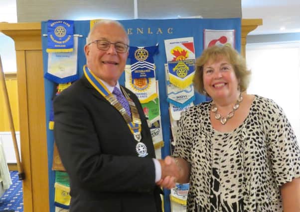 Senlac Rotary's outgoing president Linda Fearn welcomes new president Dave Miles SUS-181107-094220001
