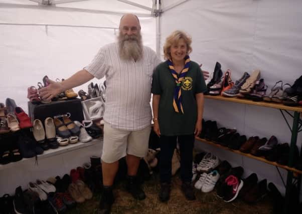 Paul and Tracey Plim with some of the shoes donated for the 9th Bexhill Scout Group's  Jumble Sale