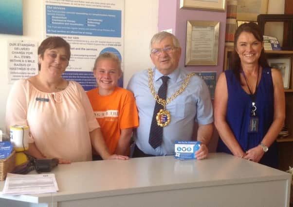 The Mayor  of Hastings  Councillor Nigel with (L-R) shop supervisor Sue Muggridge, Lilly  and retail manager Emma Dell