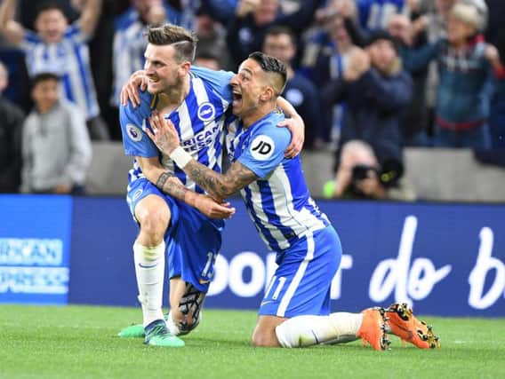 Pascal Gross celebrates scoring the winner against Manchester United with Anthony Knockaert last season. Picture by Phil Westlake (PW Sporting Photography)