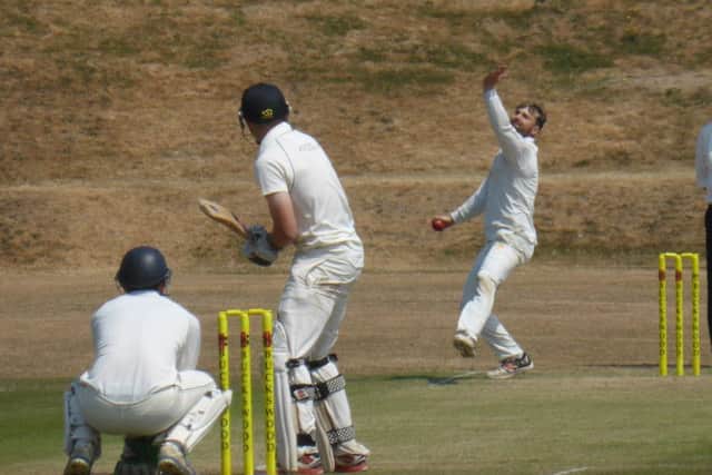 Daniel Smith bowling for Ifield at a sun-soaked Horntye Park.