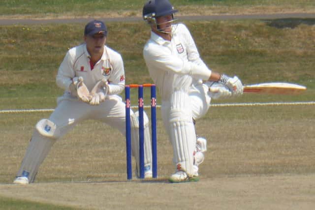 Bexhill batsman Shawn Johnson finds the leg-side boundary.