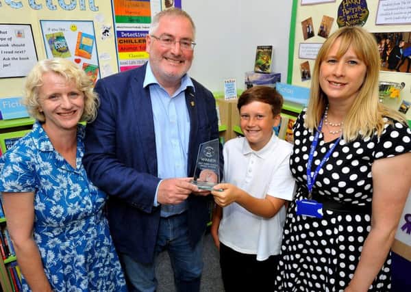 Freddie King receives his award at Steyning Primary School. Picture: Steve Robards SR1818176