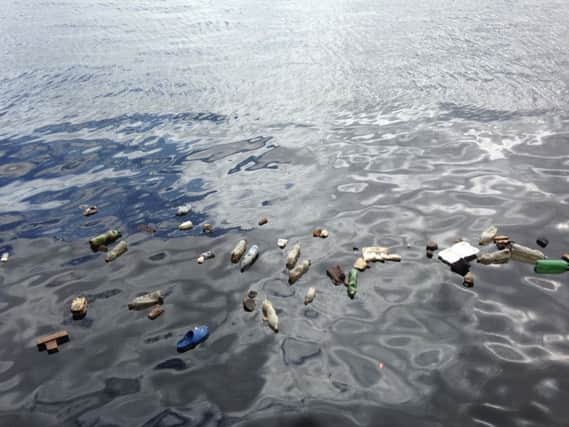 Plastic rubbish in the sea. Image licenced by Creative Commons
