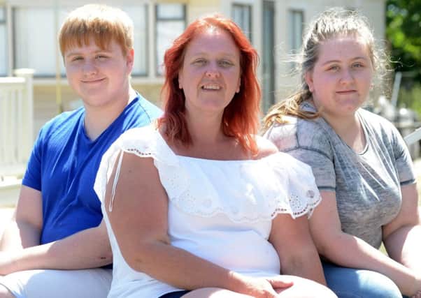 Joanne Power with her children, Lewis,16, and Ellie,17. Picture: Kate Shemilt