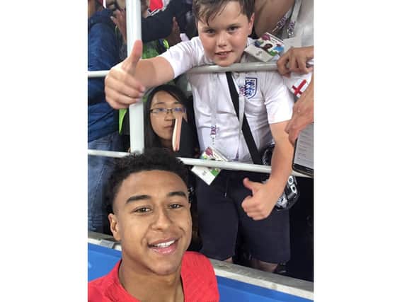Archie Robinson and England ace Jesse Lingard after the penalty victory over Colombia
