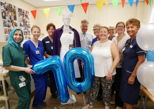 Tim Loughton with maternity staff and the old-style uniform worn by matrons