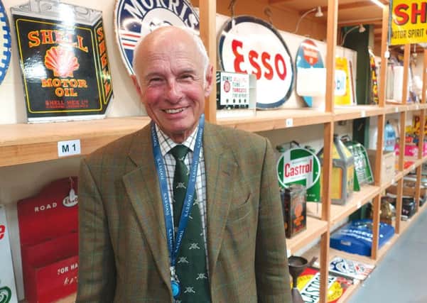Automobilia specialist Gordon Gardiner with an array of motoring collectables at Tooveys.