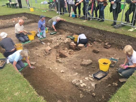 Local archaeologists from last year uncovering Roman secrets hidden beneath the ground at Priory Park. Picture contributed