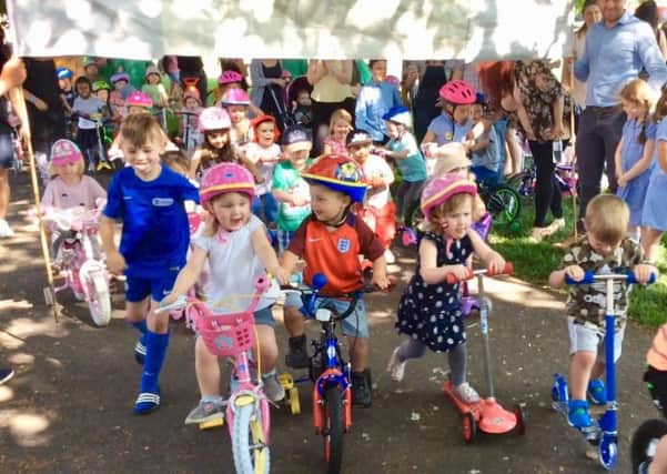 Children took to scooters and bikes for the sponsored ride around Victoria Park