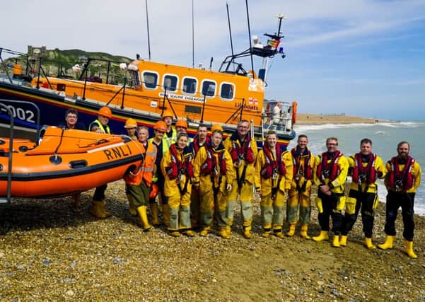 Hastings Lifeboat crew and launchers with Amber Rudd and other visitors after the lifeboat exercise SUS-160915-153436001