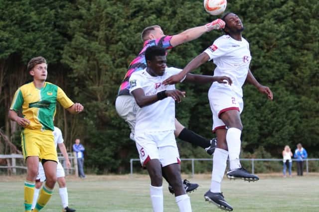 New Hastings United defender Jahmal Howlett-Mundle gets his head to the ball against Westfield. Picture courtesy Scott White