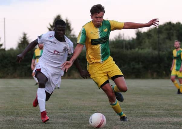 Hat-trick hero Daniel Ajakaiye in the thick of the action during Hastings United's pre-season friendly away to Westfield. Picture courtesy Scott White
