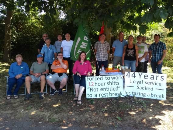 Protesters at Arundel Station against Peter Lee's (third from right) dismissal SUS-180716-122945001