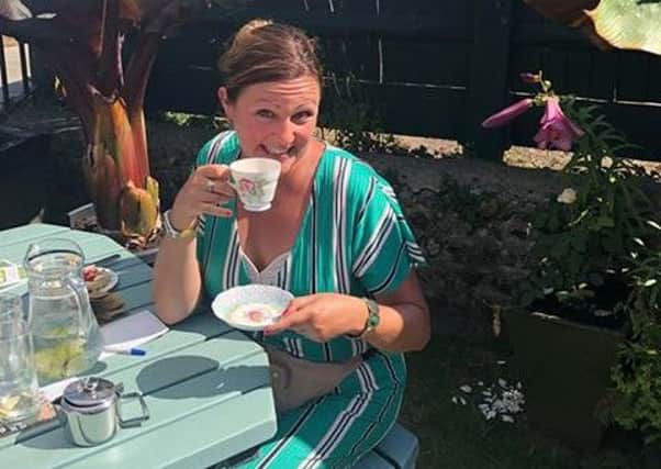 Emma Neno enjoying a cuppa at the summer garden party