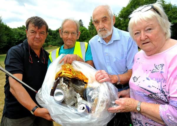 Colgate litter picker's anger at motorists who keep dumping rubbish as they pass through the village. Parish Councillors Steve Garley, John Sired, Sheila Marley - chairman, Brian Paige. Pic Steve Robards SR1818279 SUS-181007-144042001