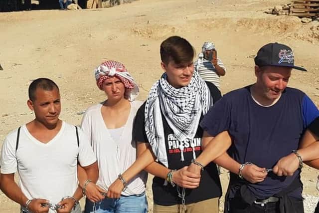 Steven Dhiman in the white t-shirt involved in a protest at Khan al-Ahmar in Palestine earlier this month