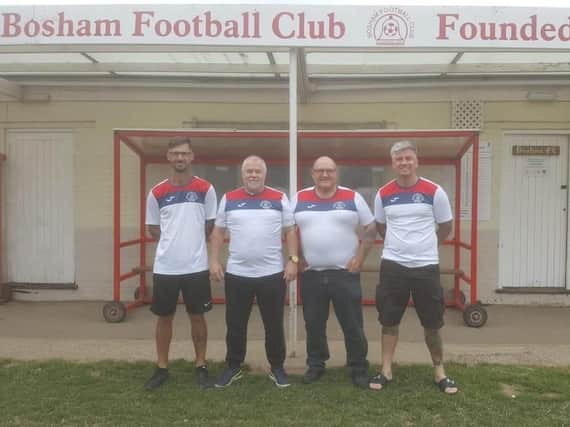 New Bosham manager Dennis Hughes (second from left)