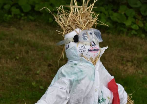The  Mad Scientist Scarecrow, made by students from St Marys school and college, Bexhill SUS-180717-132559001