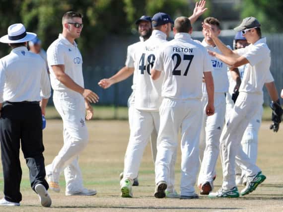Worthing celebrate a wicket in the win over Slinfold. Picture by Stephen Goodger