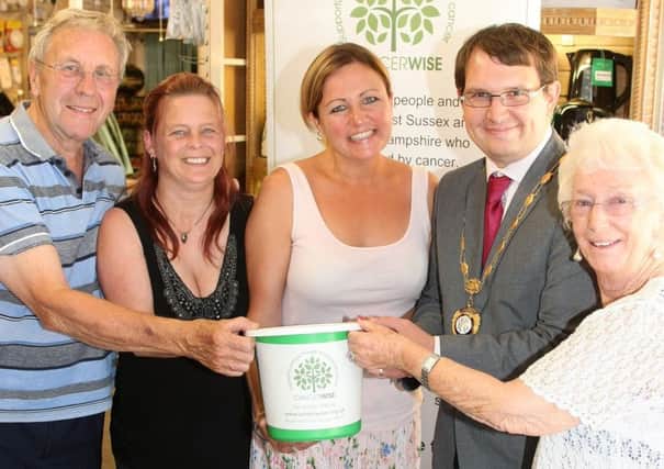 Raffle draw for Cancerwise with Cancerwise Rocks campaign at Owen Electricals. (From left) Michael Broomfield (owner), Jasia Denton (sales assistant), Emma Neno (Cancerwise fundraiser) Jamie Bennett, (chairman Rustington parish council) and Christine Greenfield (owner). Photo by Derek Martin Photography