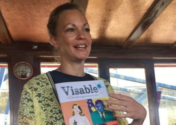 Kate Wilson with a copy of Visable Inc, the new magazine. Picture: Sophie Sheinwald