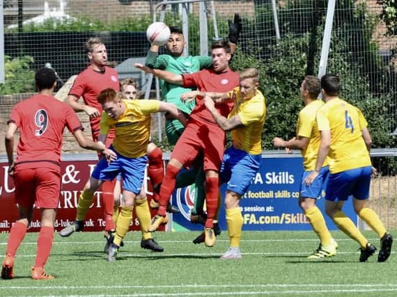 Action from Lancing's friendly clash with Sutton Common Rovers
