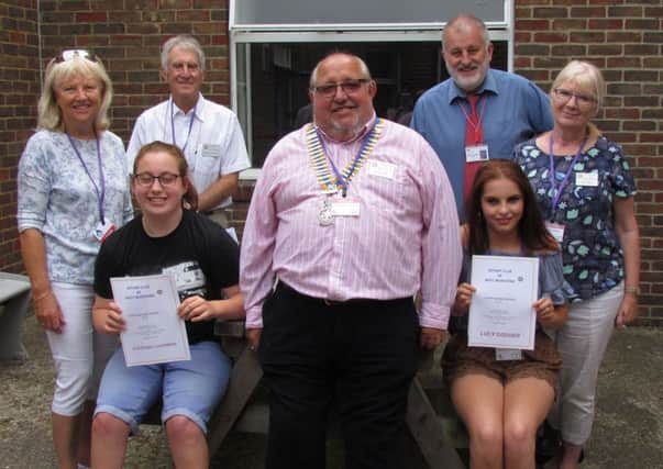 Students Lucy Godden and Courtney Charman with David Cook, president of West Worthing Rotary Club, and Rotarians Trish Sullivan, Charles Pressley, the head of centre Mark Andrews and Rotarian Sue Virgo