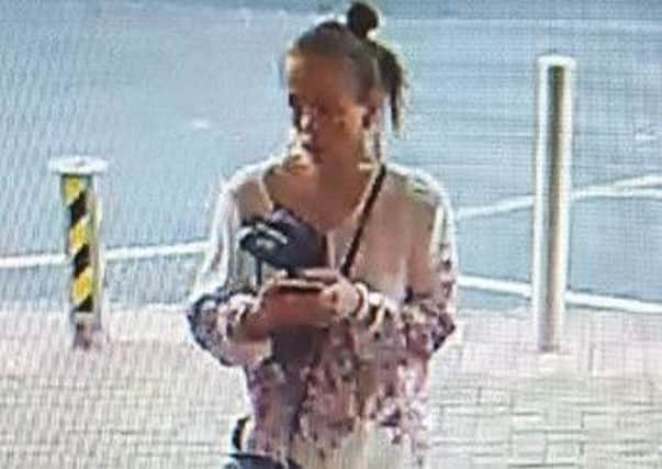 Police want to speak to this woman in connection with a theft from the Regis Centre on July 3. CCTV from Sussex Police.