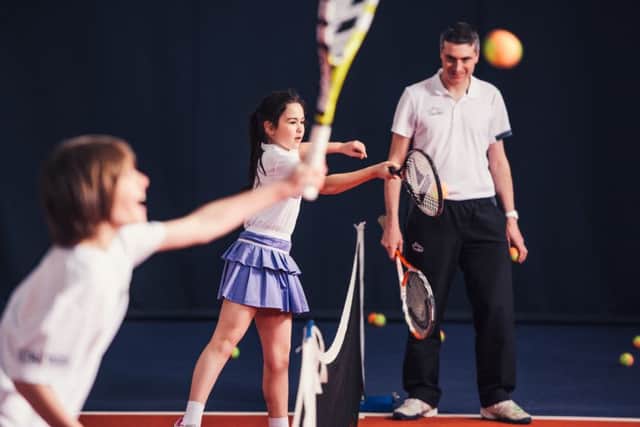Play tennis for free at David Lloyd. Picture by Mikael Buck