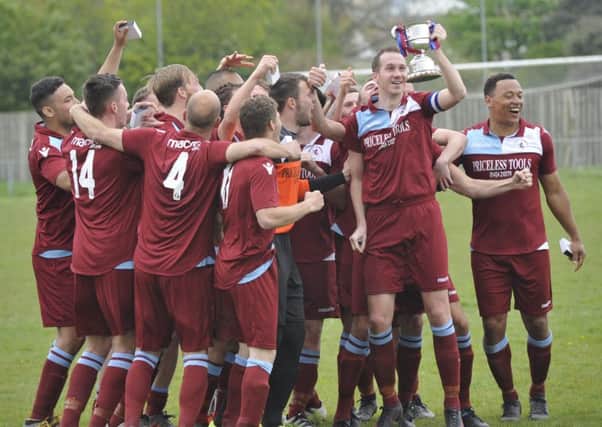 Little Common Football Club celebrates with the Macron Store Southern Combination League Division One trophy at the end of last season.