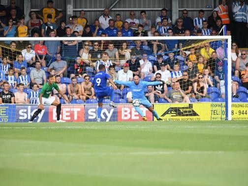Kwesi Appiah scores Wimbledon's second. Picture by Phil Westlake (PW Sporting Photography)