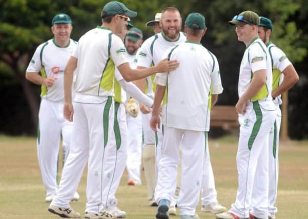 Emsworth celebrate one of Rob Norris' wickets / Picture: Kate Shemilt