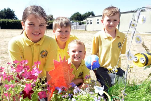 Pupils with some of the beautiful trugs created for a birthday competition, including the Blue Planet winner, centre. Picture: Kate Shemilt ks180351-9