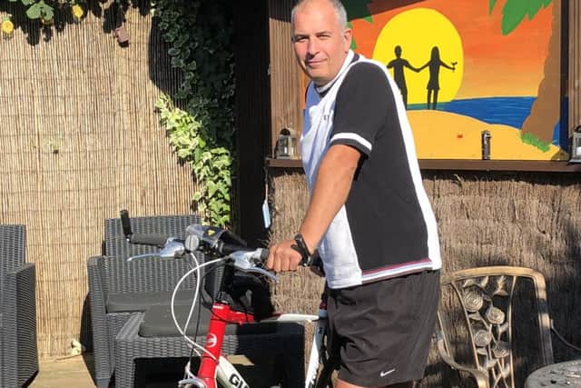 Alan Barrett, from Littlehampton, is cycling to raise funds for his brother-in-law who has been left paralysed from the waist down after falling from the roof of his Canadian home. Pictured is Alan Barrett